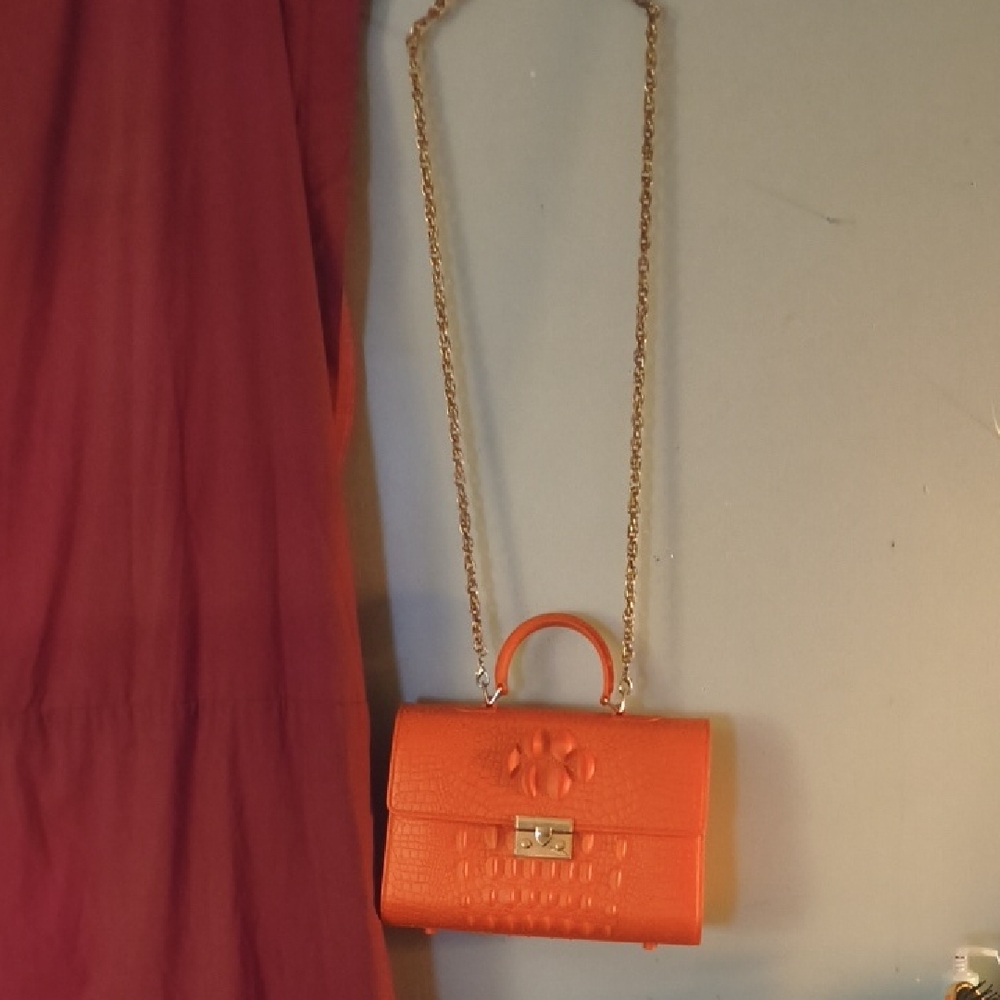Elegant Orange Crossbody Bag with Chain Strap